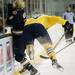 Michigan freshman right wingman Andrew Copp checks a Notre Dame player on Friday. Daniel Brenner I AnnArbor.com